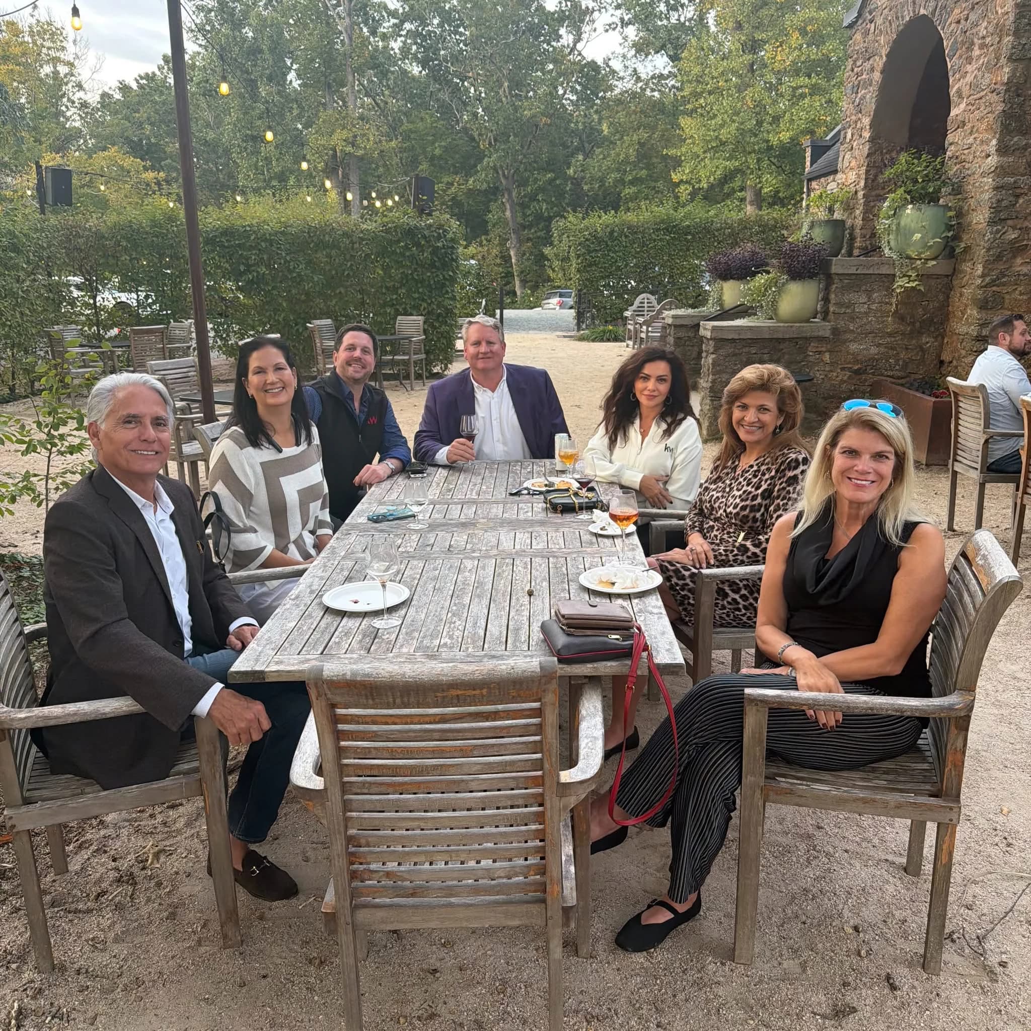 Keller Williams colleagues gathered around a table at the statewide retreat in Charlottesville