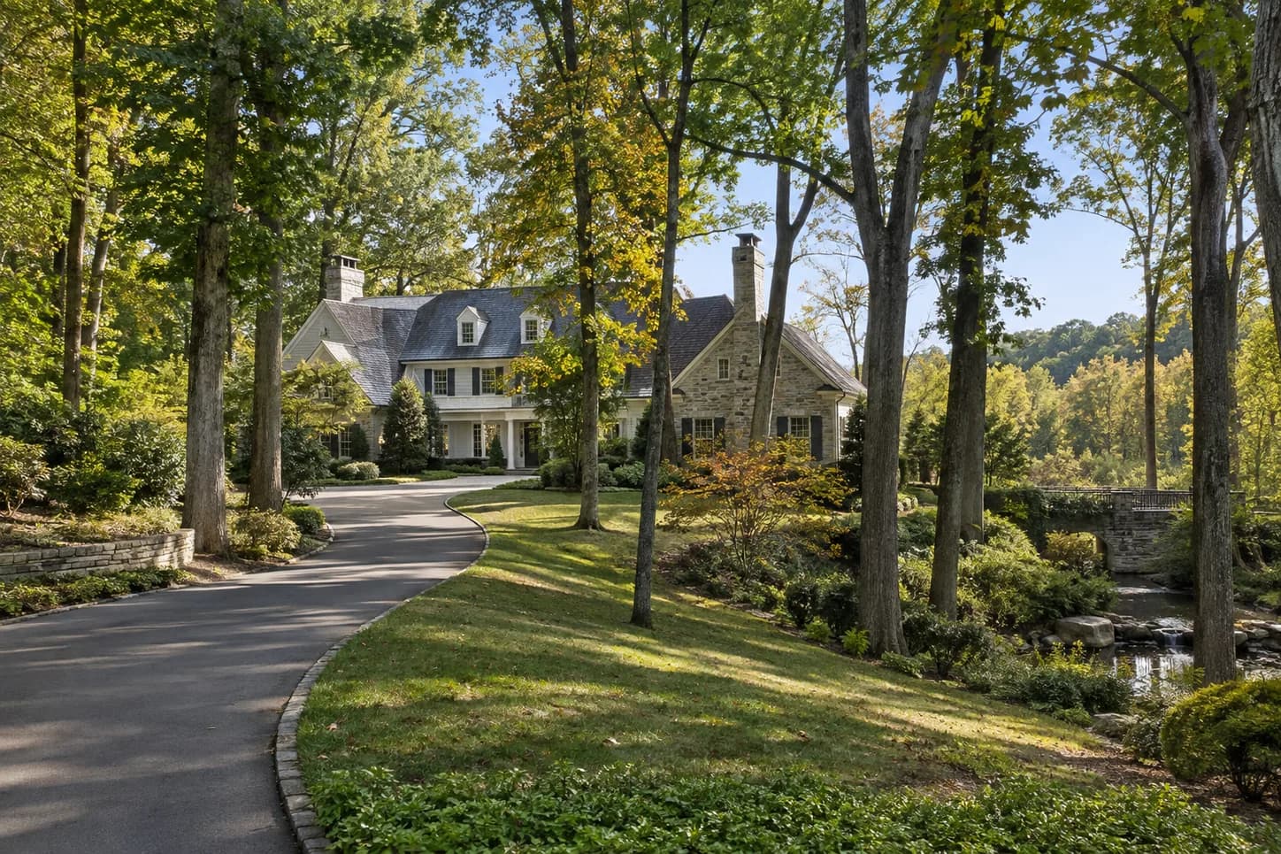 Wooded residence set back from a curved driveway