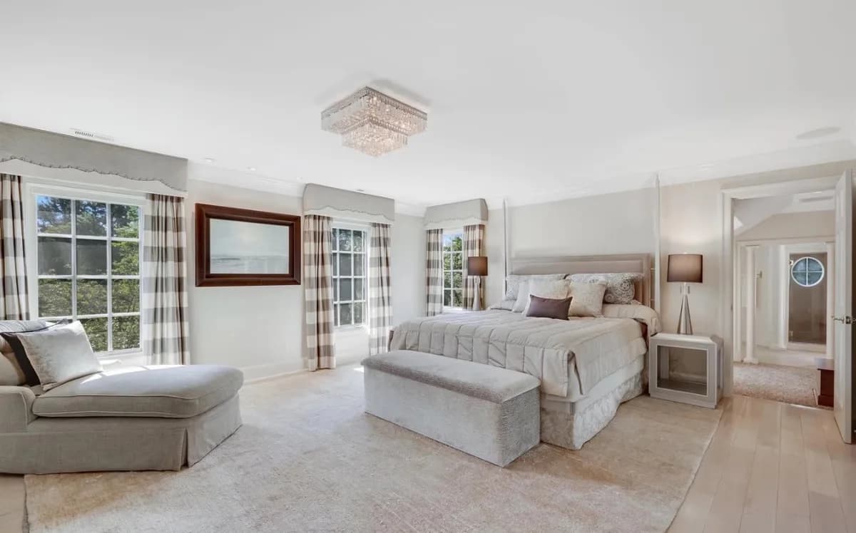 Bright bedroom inside the Great Falls mansion associated with this auction